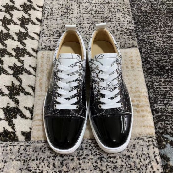 Top-down view of a pair of Christian Louboutin black and white printed trainers