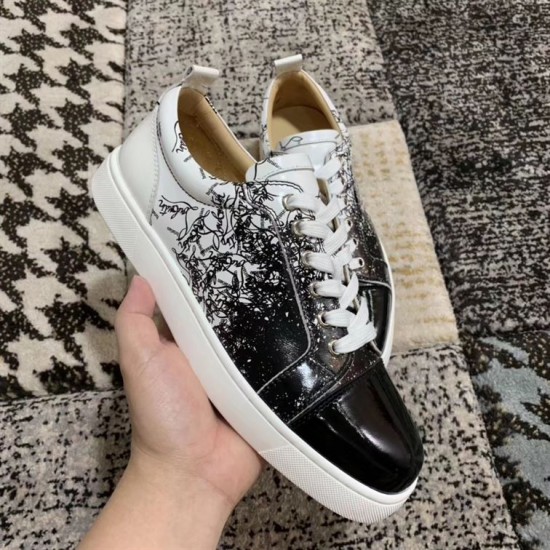 Side profile of Christian Louboutin black and white low-top trainers with white rubber sole