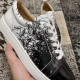 Detailed close-up of the black and white graphic script print on Christian Louboutin trainers