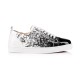 Side view of Christian Louboutin low-top trainers in black and white print with patent toe