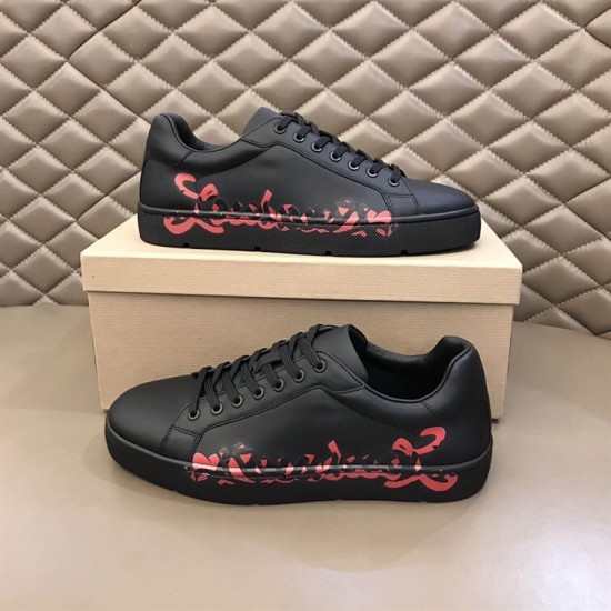 Christian Louboutin Black Trainers Pair Display in black and red Pair of Christian Louboutin black trainers displayed with shoe box in black and red