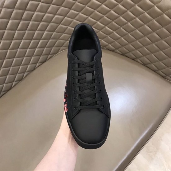 Christian Louboutin Black Trainer Front View in black and red Front upper view of Christian Louboutin black leather trainer showing laces in black and red