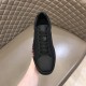 Christian Louboutin Black Trainer Front View in black and red Front upper view of Christian Louboutin black leather trainer showing laces in black and red