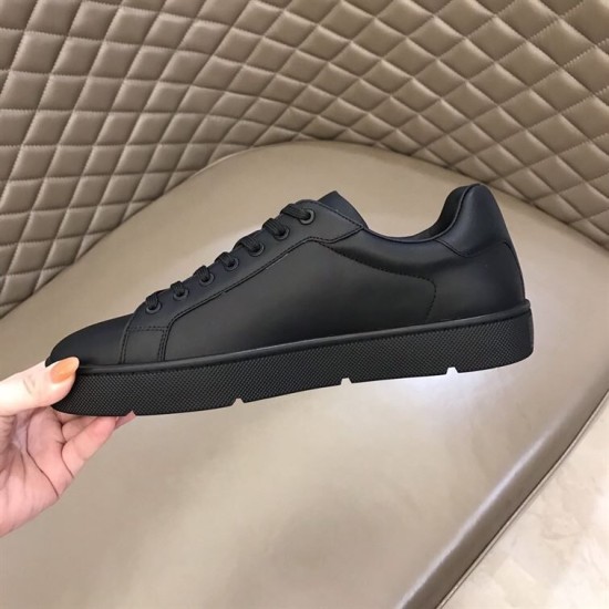 Christian Louboutin Black Trainer Medial Side View in black and red Inner medial view of Christian Louboutin plain black leather trainer upper in black and red
