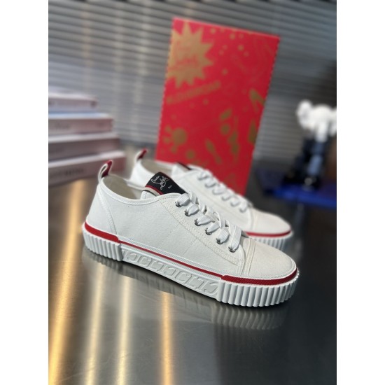 Three-quarter view of Christian Louboutin white trainers with red midsole trim