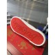 Underside view showcasing the signature red rubber sole with embossed signature in white and red