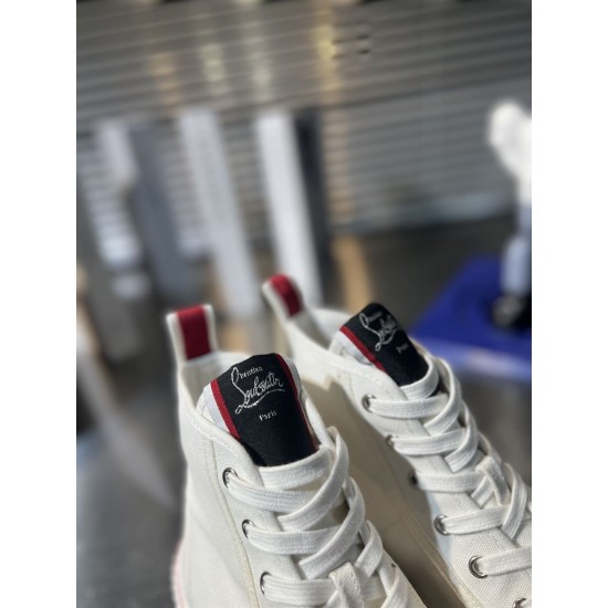 Christian Louboutin Tongue Patch and Lacing Detail in white Close-up of Christian Louboutin branded tongue patches and laces in white