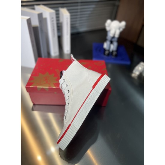 Christian Louboutin White Canvas High Top Lateral View Christian Louboutin white canvas trainer resting on red box