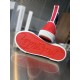Underside view showcasing the signature red outsole of Christian Louboutin Pedro Junior Trainers in navy and red