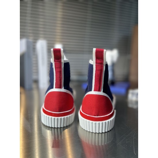 Rear heel view of Christian Louboutin Pedro Junior High-Top Canvas Trainers showing red panels in navy and red
