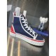 Close-up profile of navy Christian Louboutin Pedro Junior High-Top Canvas Trainer with white piping in navy and red