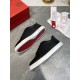 Christian Louboutin Rantulow trainers showing the signature red outsole and black textured upper