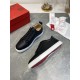 Christian Louboutin Rantulow black trainer displaying white rubber midsole and red sole edge