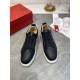 Pair of Christian Louboutin Rantulow black leather trainers top-down view