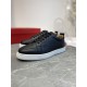 Christian Louboutin Rantulow black low top trainers angled front view on surface