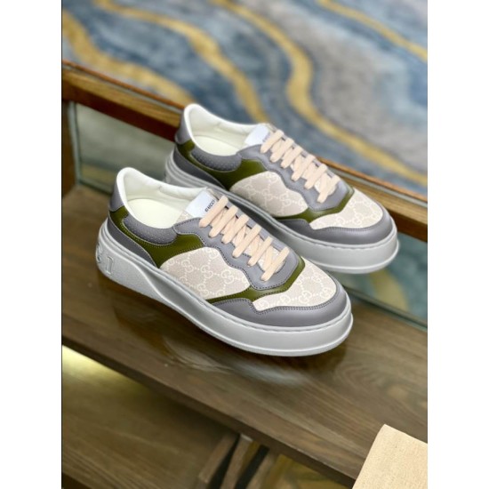 Gucci Monogram Low Top Top Angle View in beige and white Top-down angled view of Gucci beige and grey leather monogram trainers resting on wooden shelf in beige and white