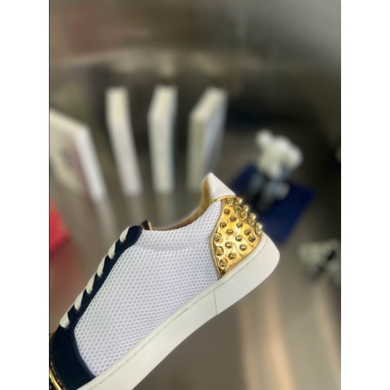 Christian Louboutin Low Top Mesh Spiked Heel Detail in black and white Close-up view of the gold metallic spiked heel on the Christian Louboutin white mesh trainers in black and white