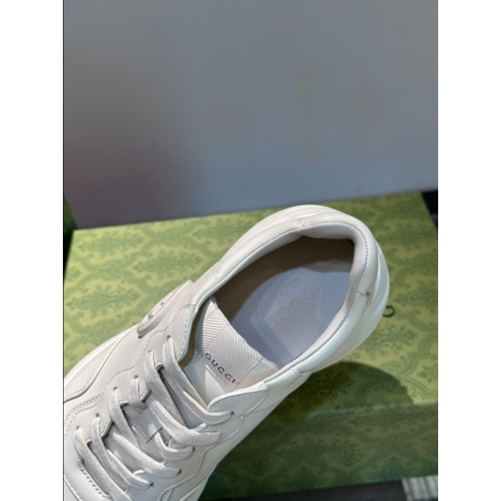 Top-down view inside off-white leather trainer showing branded insole