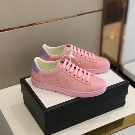 Pair of Gucci New Ace Pink and Purple Leather Trainers Pair of Gucci New Ace pink and purple leather trainers resting on a shoe box