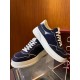 Gucci Lace-Up Dark Navy Blue And White Trainers Pair Display Pair of Gucci Lace-Up Dark Navy Blue And White Trainers displayed on a glass stand