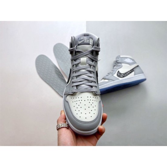 Front view of Dior High Top Trainers Grey And White Leather held in hand