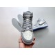Front view of Dior High Top Trainers Grey And White Leather held in hand
