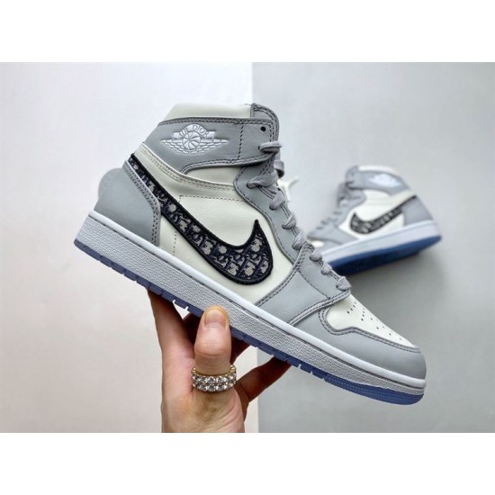 Side profile of Dior High Top Trainers Grey And White Leather held at angle