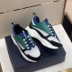 Dior B22 Blue Green Trainer Pair Angled Front View Angled top-front view of Dior B22 blue deep green trainers on box