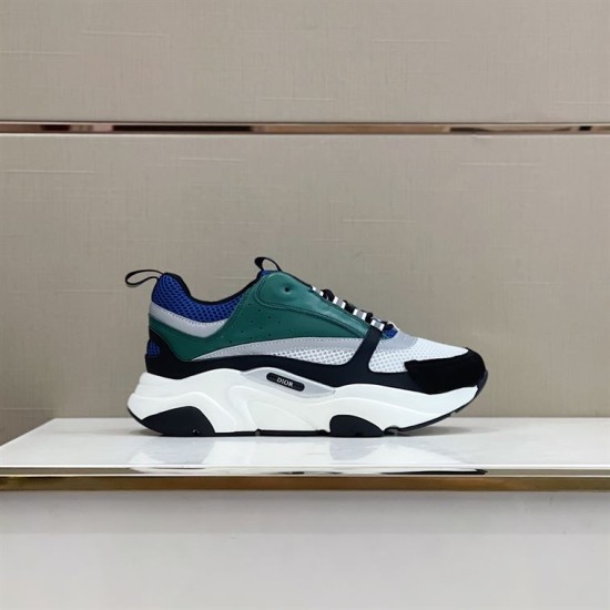 Dior B22 Blue Green Trainer Display View Dior B22 blue and green chunky trainer side view displayed on a shelf