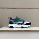 Dior B22 Blue Green Trainer Display View Dior B22 blue and green chunky trainer side view displayed on a shelf
