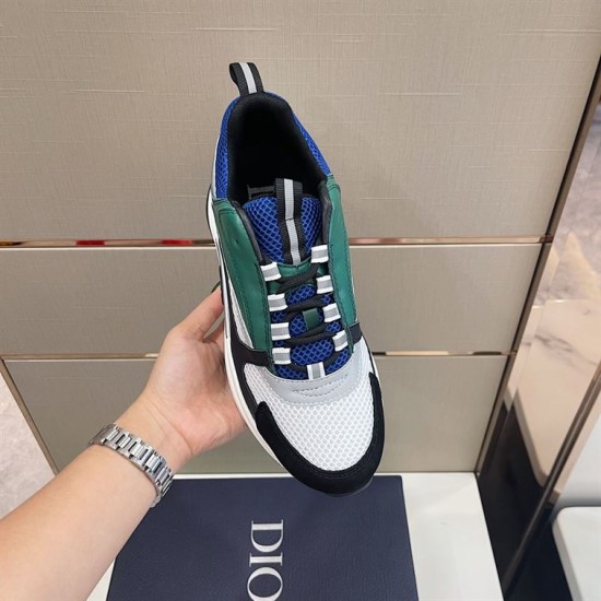Dior B22 Blue Green Trainer Top-Down Lacing View Top-down hand view of Dior B22 trainer showing laces and blue mesh tongue in blue and green