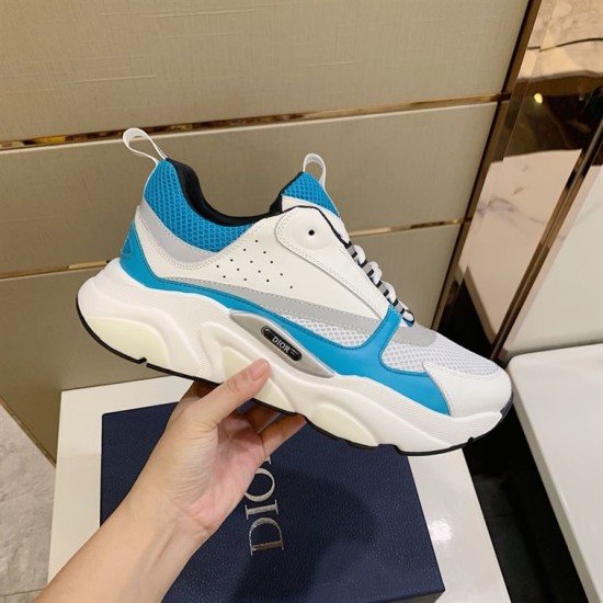 Dior B22 Light Blue And White Chunky Trainers held at side angle