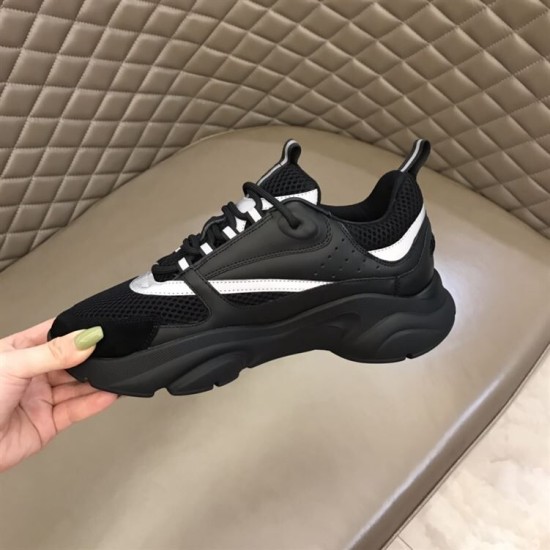 Dior B22 Technical Mesh And Leather Black Trainers Side Detail Side profile of black Dior B22 Trainer showing white accent stripes
