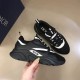 Dior B22 Technical Mesh And Leather Black Trainers Handheld View Dior B22 Technical Mesh And Leather Black Trainers held at an angle