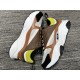 Dior B22 Brown Trainers Medial Side View in brown and lime Medial side view of Dior B22 brown leather and mesh low top trainers in brown and lime