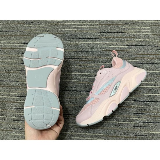 Dior B22 Pink Trainer Sole and Tread View in pink and white Bottom grey rubber tread sole view of Dior B22 Pink Trainer next to shoe side profile in pink and white