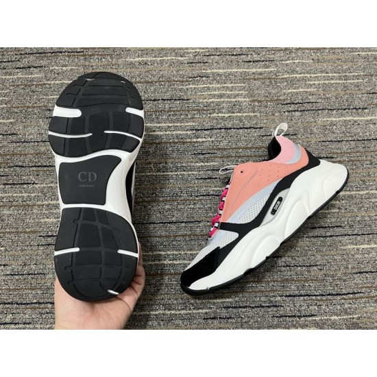 Black rubber outsole tread view of Dior B22 trainer in pink and white