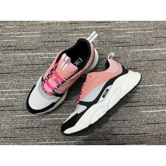 Pair of Dior B22 pink white and black trainers shown from above angle