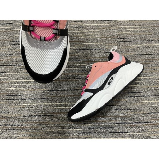 Front toe box detail of Dior B22 trainer with white mesh and black suede toe cap in pink and white