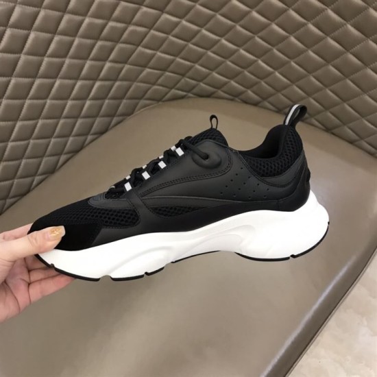 Dior B22 Black Trainer Inner Side Profile in black and white Medial side view of the Dior B22 black technical mesh trainer displaying perforation details in black and white