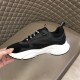 Dior B22 Black Trainer Inner Side Profile in black and white Medial side view of the Dior B22 black technical mesh trainer displaying perforation details in black and white