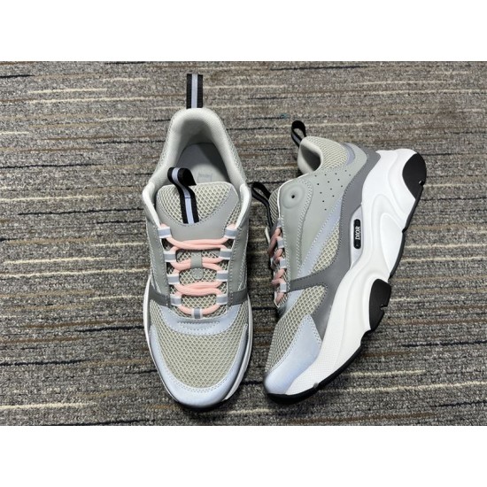 Dior B22 Grey Trainers Perspective View in grey and white Top and side view of Dior B22 grey trainers pair in grey and white