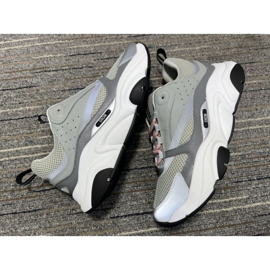 Dior B22 Grey Trainers Pair Display in grey and white Pair of grey Dior B22 trainers displayed side by side in grey and white