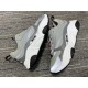 Dior B22 Grey Trainers Pair Display in grey and white Pair of grey Dior B22 trainers displayed side by side in grey and white