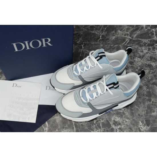 Dior B22 Trainers Top View in grey and white Top-down view of pair of grey, white and blue mesh leather trainers alongside branded box