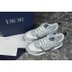 Dior B22 Trainers Top View in grey and white Top-down view of pair of grey, white and blue mesh leather trainers alongside branded box