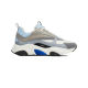 Dior B22 Trainers Lateral View in grey and white Lateral profile view showing blue accent insert on chunky sculpted sole unit in grey and white