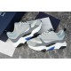 Dior B22 Trainers Pair Display in grey and white Pair of grey white and blue leather mesh trainers displayed next to navy box and card