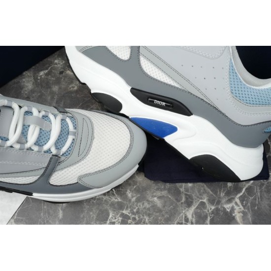 Dior B22 Trainers Upper Detail in grey and white Close-up of white mesh toe box, grey leather panelling and side logo plaque