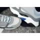 Dior B22 Trainers Upper Detail in grey and white Close-up of white mesh toe box, grey leather panelling and side logo plaque